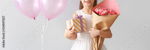 Little girl with bouquet of...