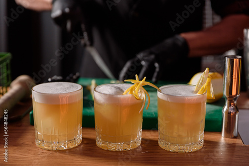 professional bartender preparing cocktails at the bar