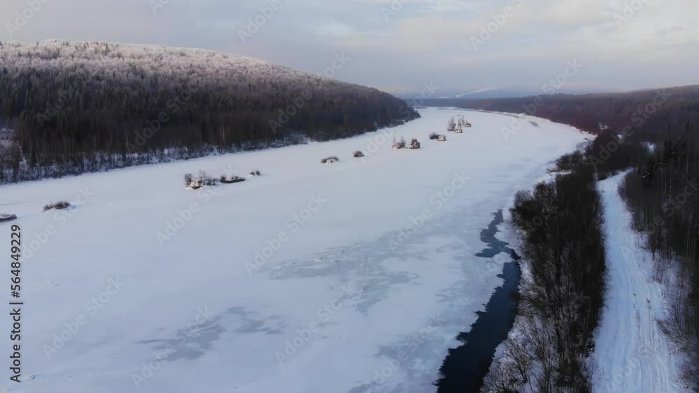 Icy Winter River with Snowy Forest Aerial View Icy Winter River with Snowy Forest Aerial View