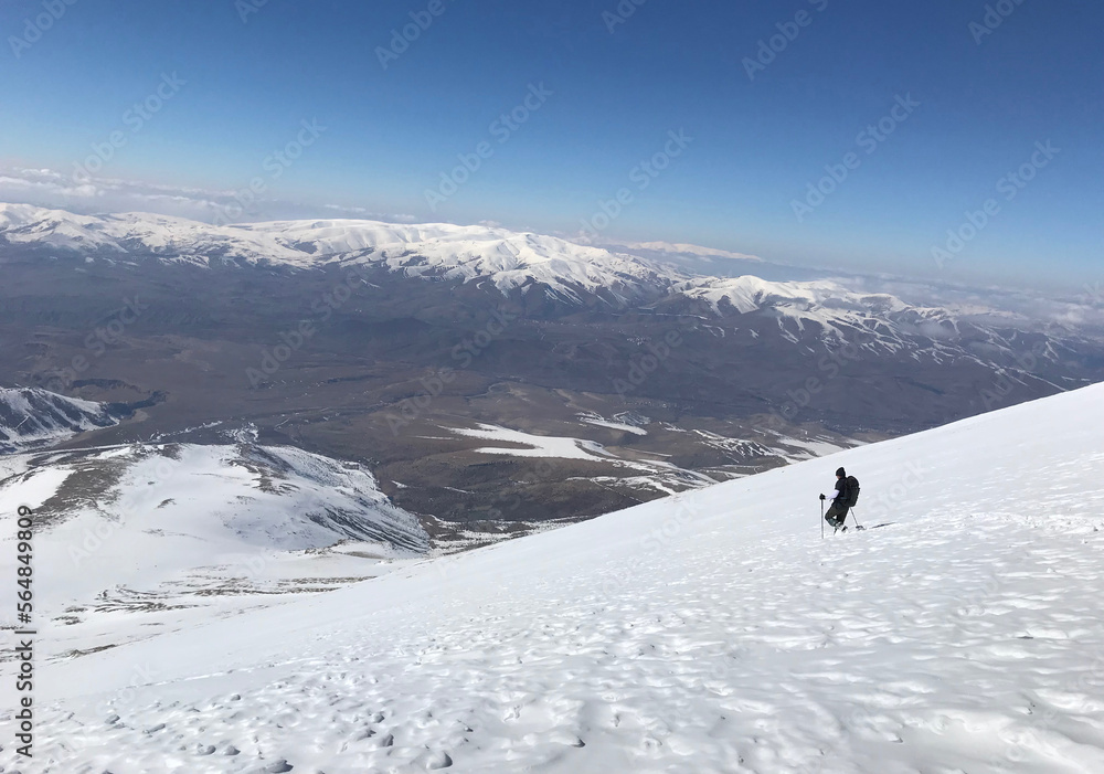 Mountaineer going down on Mount Eznevit at Aladaglar Mountain Range in Nigde, Turkey. Aladaglar is most important mountain range in Turkey.
