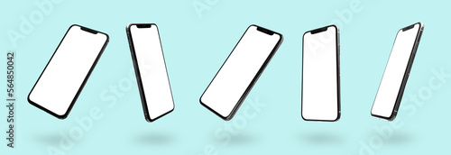 Set of mobile phones with blank screens on turquoise background