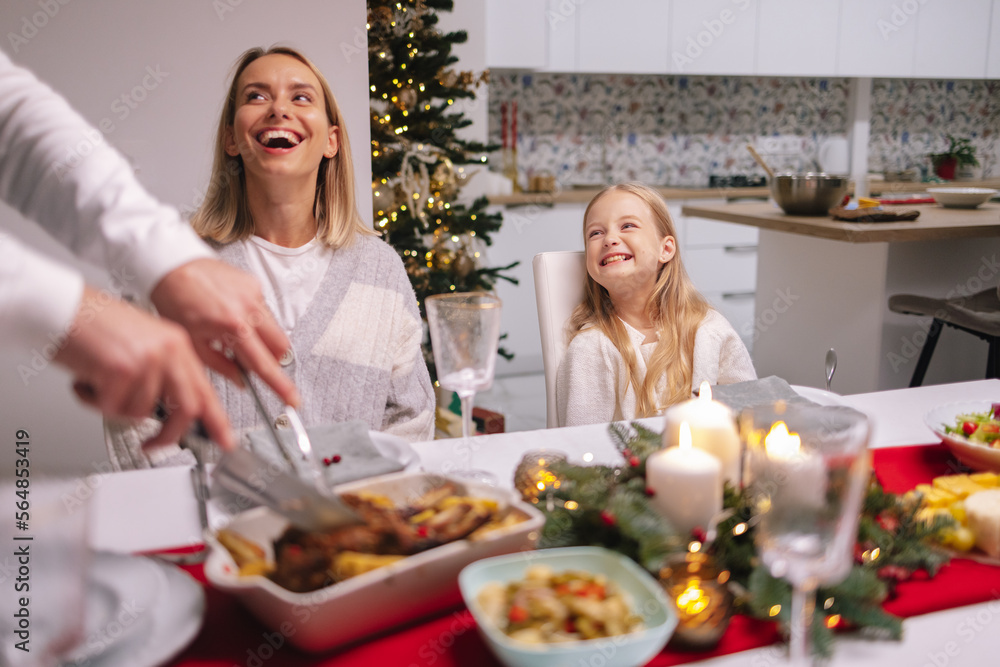 Tradition Christmas dinner meal knife cut meal cheerful family Tradition Christmas dinner meal knife cut meal cheerful family