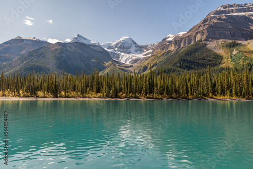 View of Rocky Mountains from a boat in Maligne Lake, Jasper NP, Canada photo