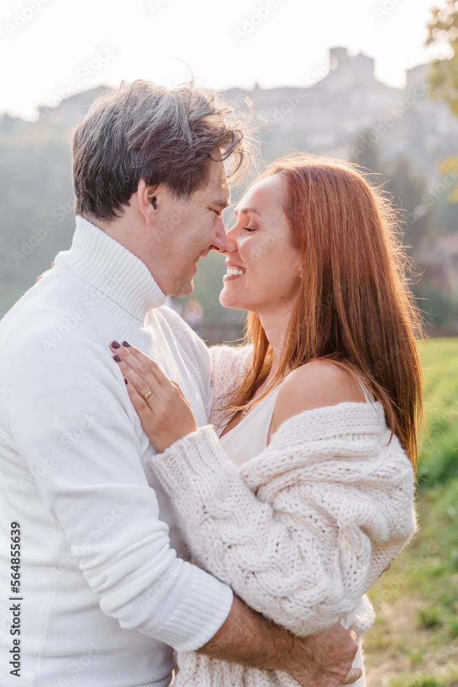 Loving couple husband and wife are smiling, hugging and look at Loving couple husband and wife are smiling, hugging and look at