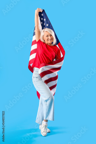 Mature woman with USA flag ...