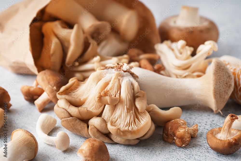 Fresh raw mushrooms on light table, closeup