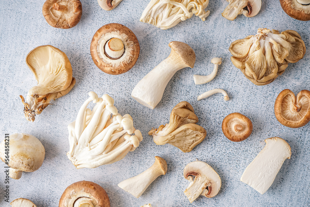 Composition with fresh mushrooms on light background Composition with fresh mushrooms on light background
