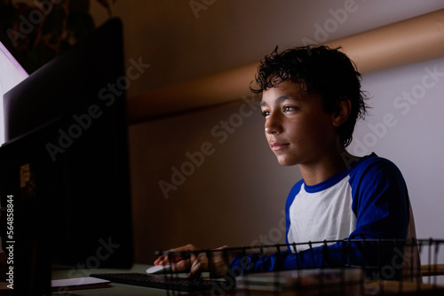teen boy studying at night
