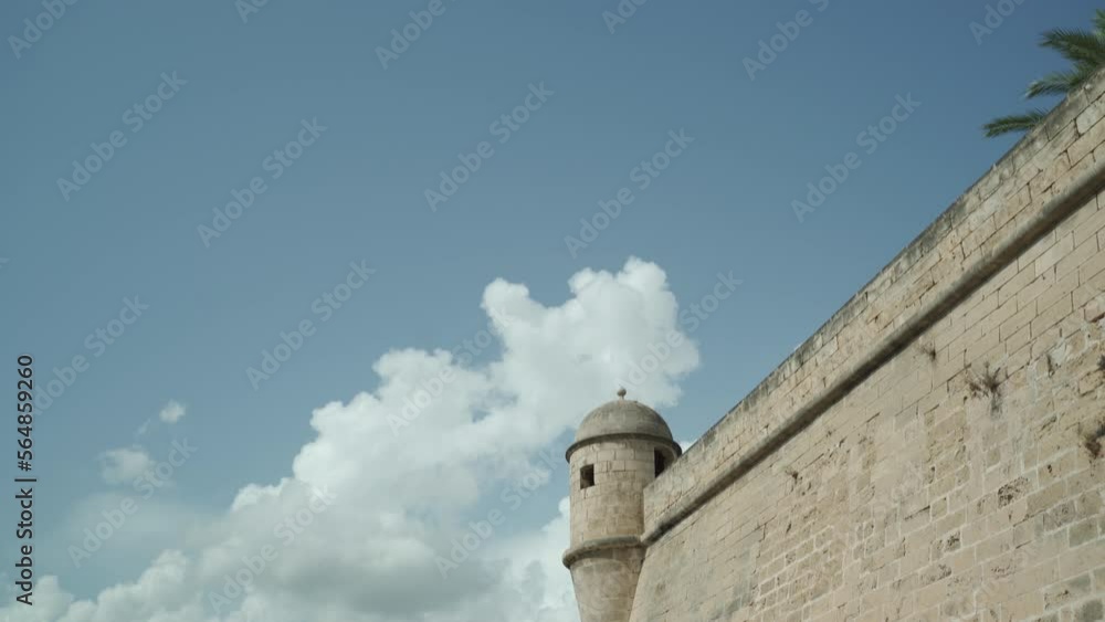 Turret on Surrounding Walls of Royal Palace of La Almudaina, Palma de Mallorca Panning up on a Sunny Day Turret on Surrounding Walls of Royal Palace of La Almudaina, Palma de Mallorca Panning up on a Sunny Day