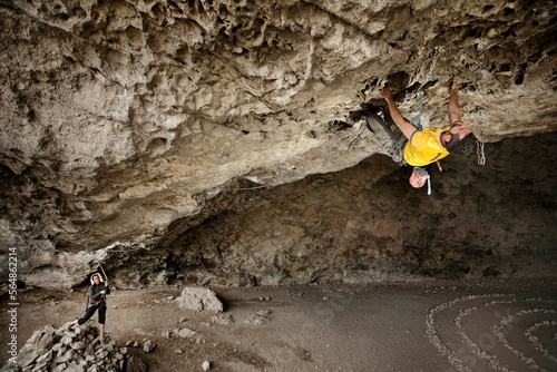 A man climbing at the Actopan cave, Hidalgo, Mexico. photo