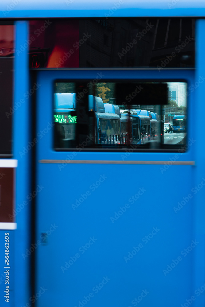 Blue bus and red face Blue bus and red face