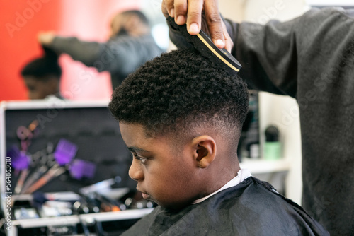 Barber: Barber Texturizes Boy's Hair photo