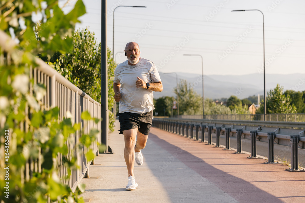 Senior Man Building Stamina For A Marathon Senior Man Building Stamina For A Marathon
