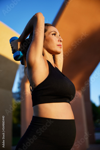 Wallpaper Mural Pregnant female athlete exercising in morning Torontodigital.ca