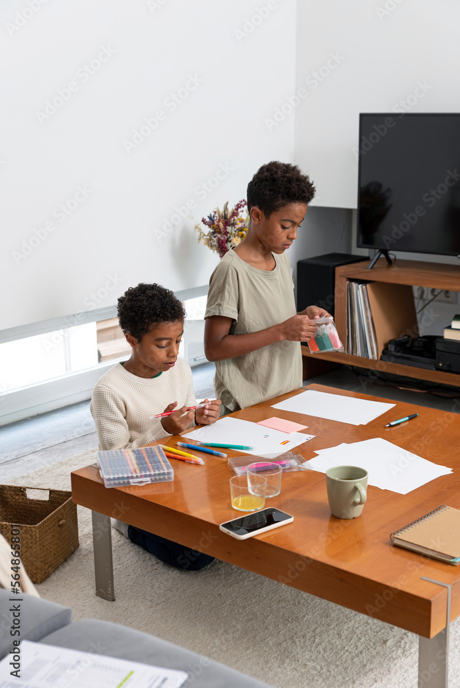 Two boys drawing after school Two boys drawing after school