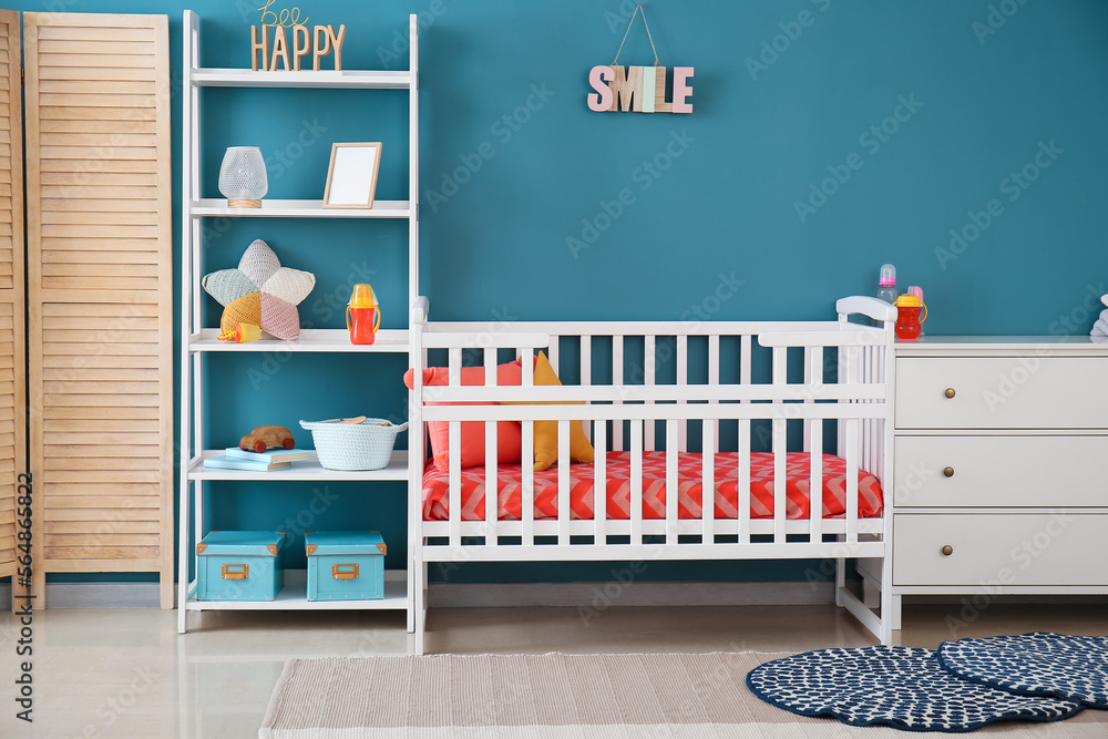 Stylish interior of children's room with baby bed Stylish interior of children's room with baby bed