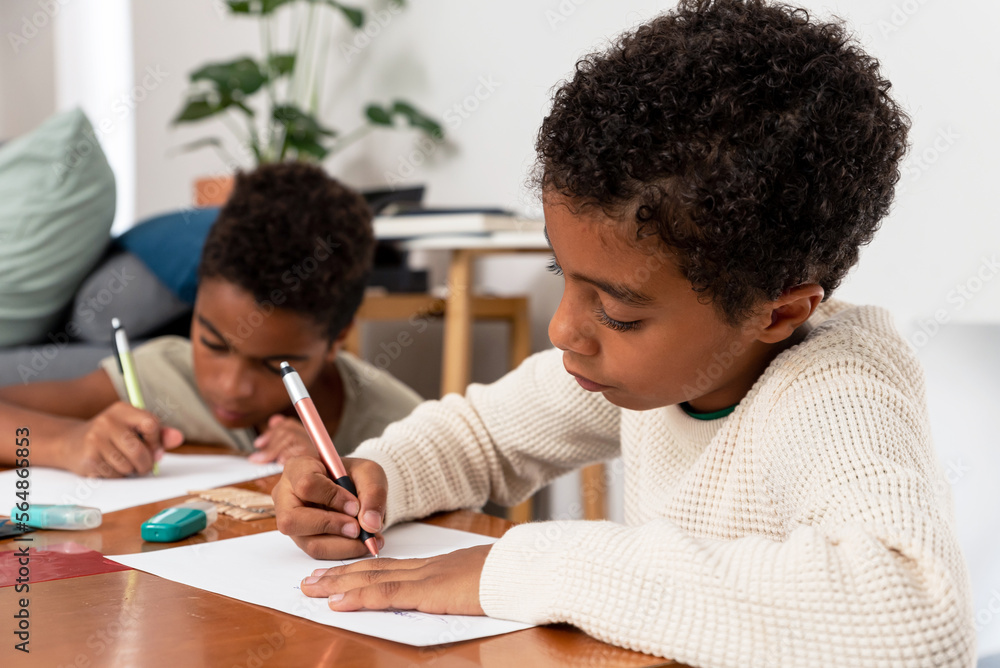Two boys drawing after school Two boys drawing after school