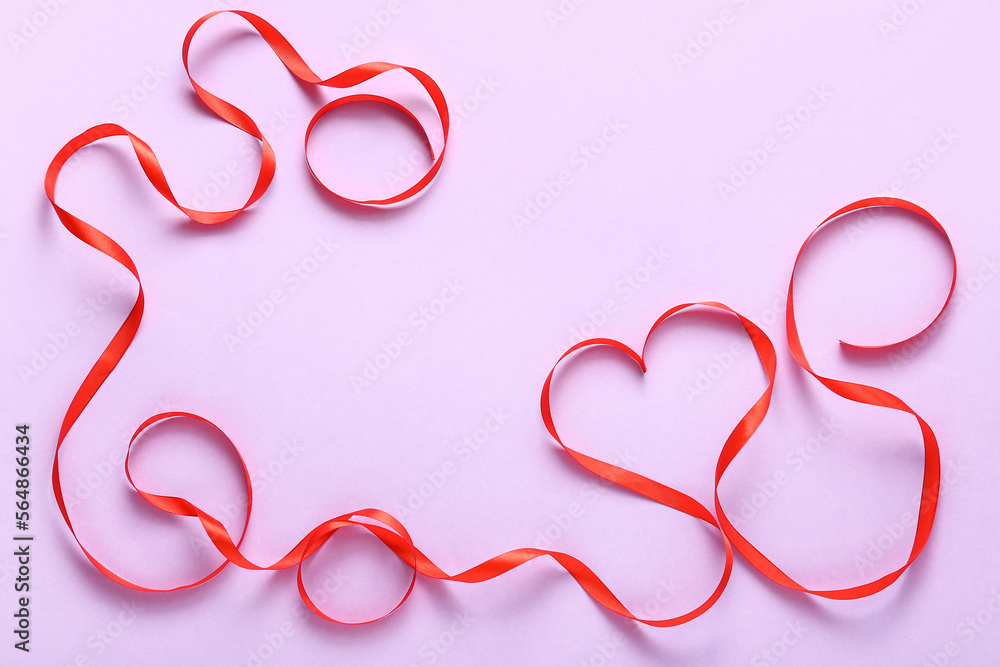 Heart made of red ribbon on lilac background. Valentine's Day celebration Heart made of red ribbon on lilac background. Valentine's Day celebration
