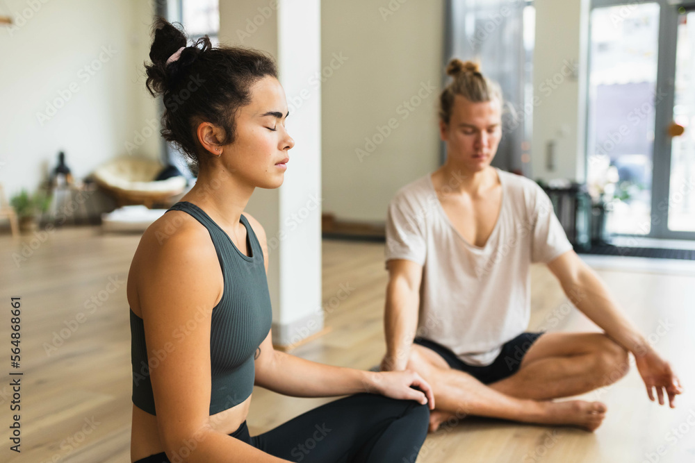 Meditating in a studio Meditating in a studio