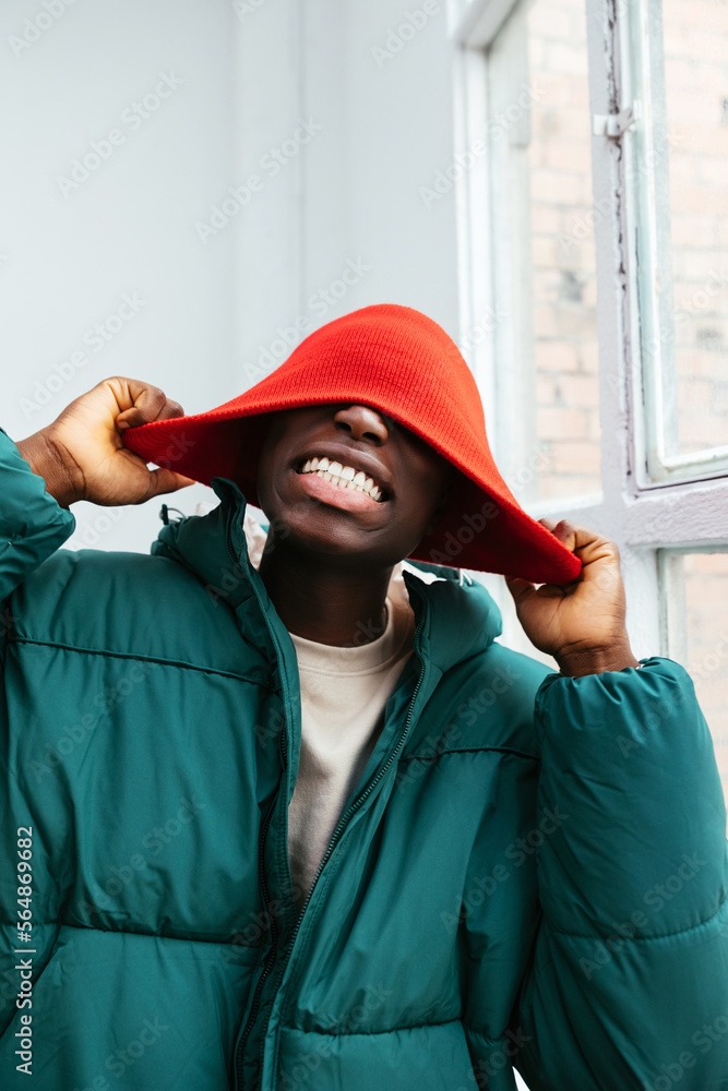 © BONNINSTUDIO/Stocksy - Cheerful stylish man in trendy clothes