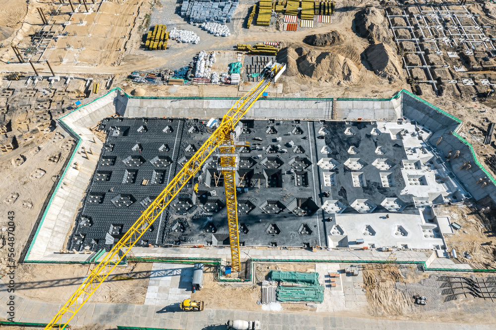slab-on-grade foundation on construction site. busy construction site ...