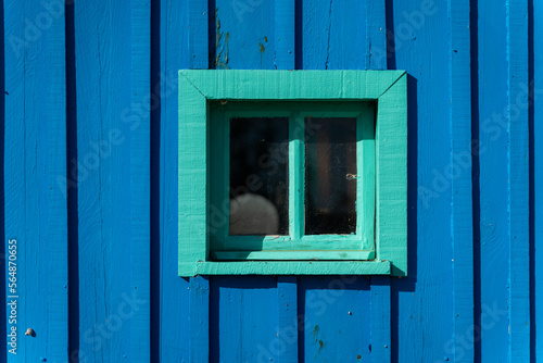 Small window on cabin photo