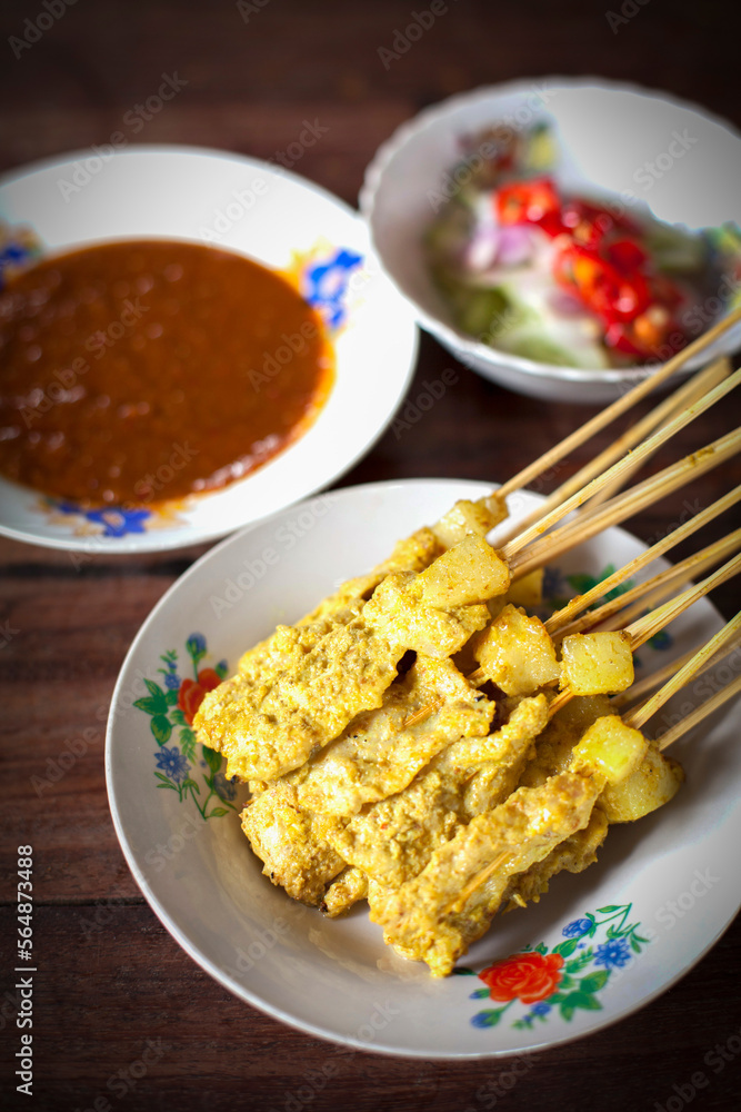 Pork satay, Grilled pork served with peanut sauce or sweet and sour sauce, Thai food, - Asian food style Pork satay, Grilled pork served with peanut sauce or sweet and sour sauce, Thai food, - Asian food style