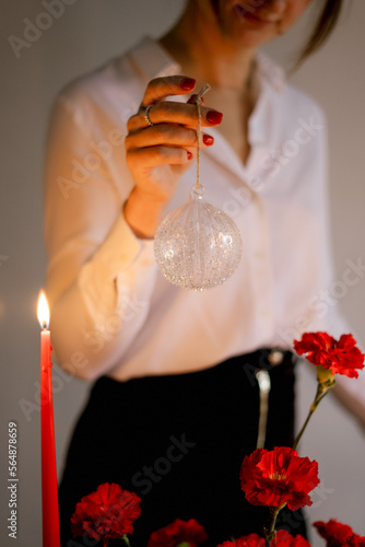 woman holding beautiful glass Christmas toys and decorations photo