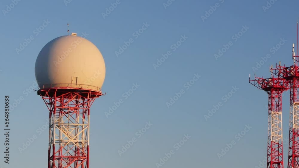 Panning shot from a radar dome to triple antennas at the Alicante-Elche international airport. Sunset light. Panning shot from a radar dome to triple antennas at the Alicante-Elche international airport. Sunset light.