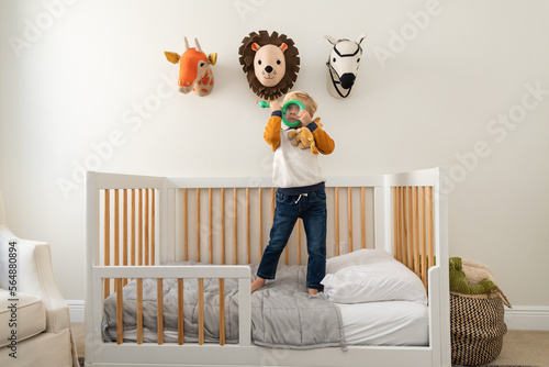 Wide angle image of boy with toy photo