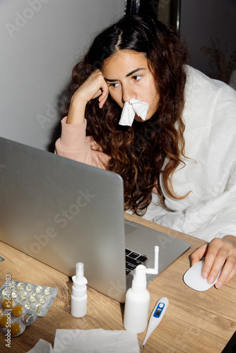 Woman sick and working at home