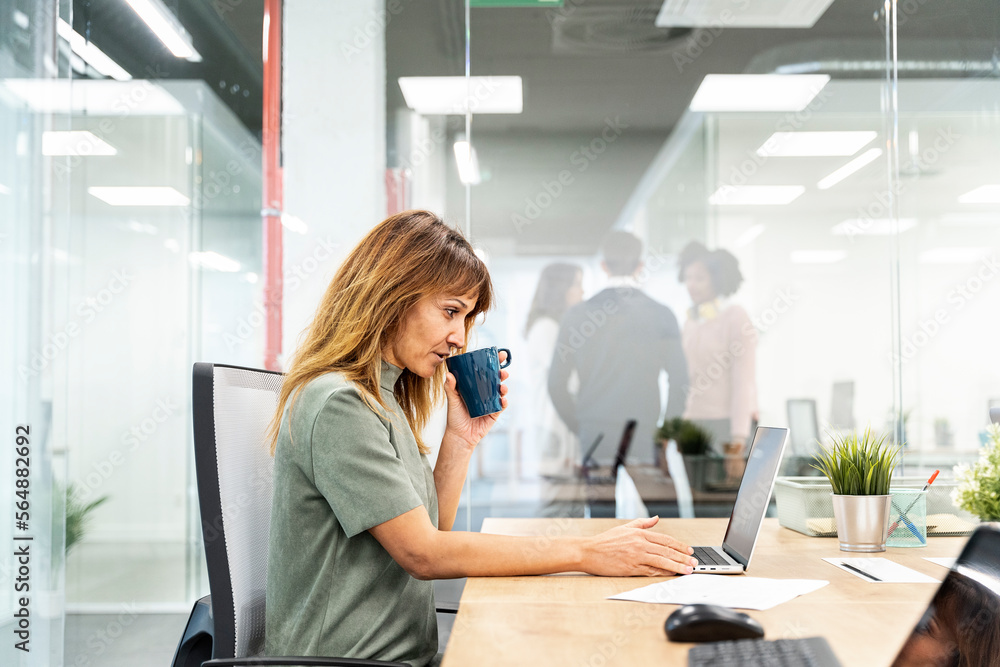 Businesswoman Drinking Cup of Coffee Businesswoman Drinking Cup of Coffee