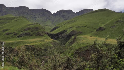 Verdant green highland plateau cliff waterfall in Lesotho Africa photo