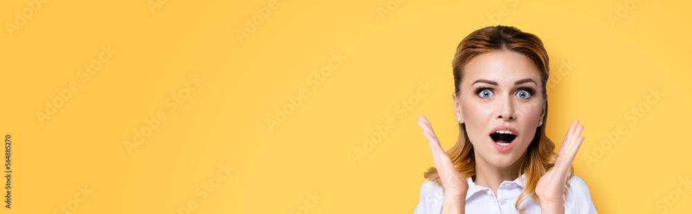 Excited surprised, shocked or very happy amazed young business woman with wide opened mouth and eyes, raised up hands. Face portrait studio image, wide composition. Excited surprised, shocked or very happy amazed young business woman with wide opened mouth and eyes, raised up hands. Face portrait studio image, wide composition.