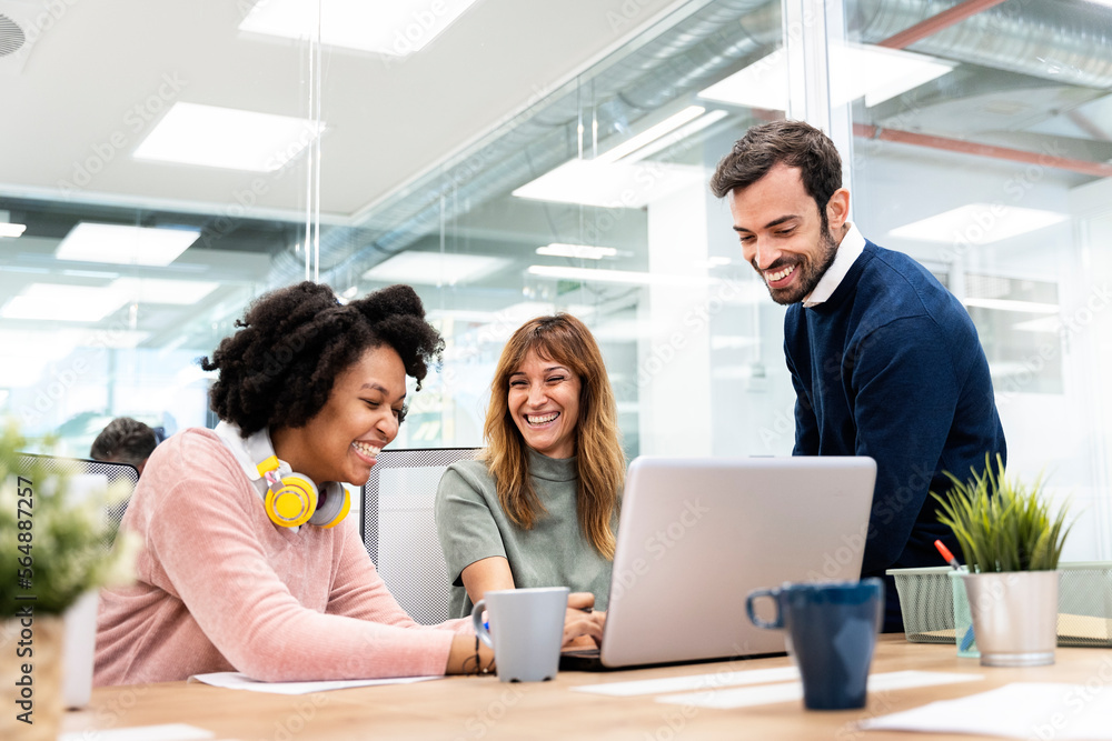 Happy Coworkers Talking in the Office Happy Coworkers Talking in the Office