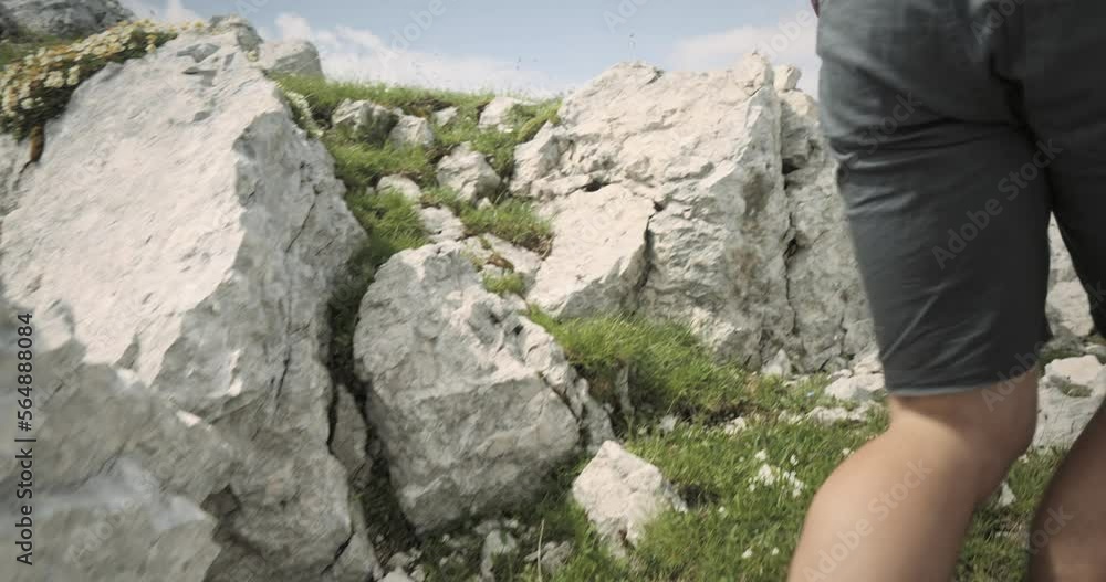 Camera tracking a hiker from behind up a hill on his jurney towards the top of muntain Rombon. Other mountains are visible in the background. Camera tracking a hiker from behind up a hill on his jurney towards the top of muntain Rombon. Other mountains are visible in the background.