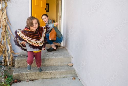 Mother and son coming home having fun photo