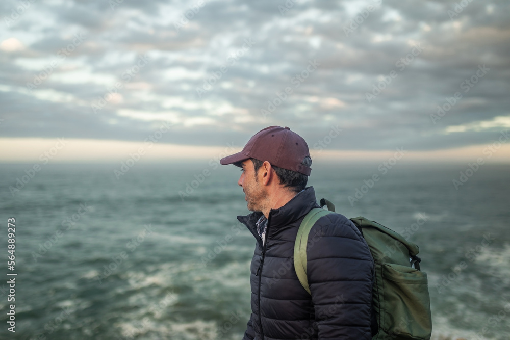 traveler man on top of a mountain by the sea traveler man on top of a mountain by the sea