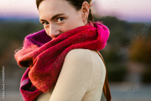 Crop woman with fuschia scarf outdoor portrait photo