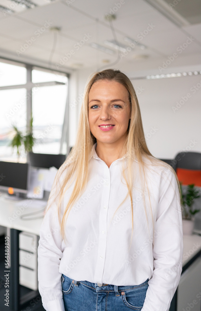 © Hernandez & Sorokina/Stocksy - Portrait Of Woman At Office © Hernandez & Sorokina/Stocksy - Portrait Of Woman At Office