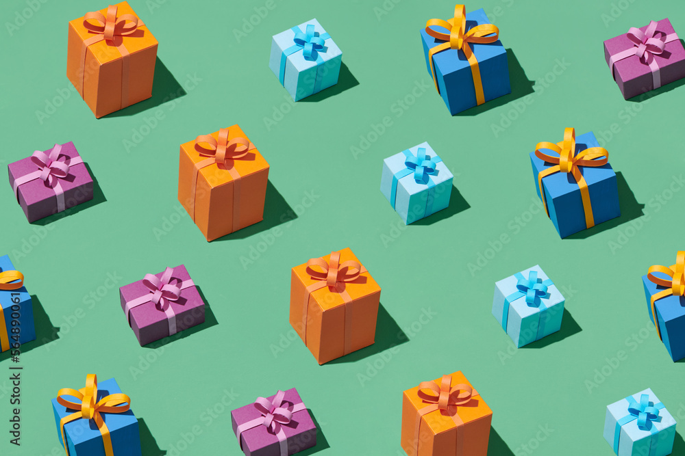 Seamless pattern of many color gift boxes with shadow on green. Seamless pattern of many color gift boxes with shadow on green.