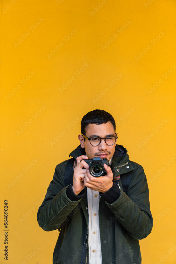 Young Adult Man with a Digital Camera Young Adult Man with a Digital Camera