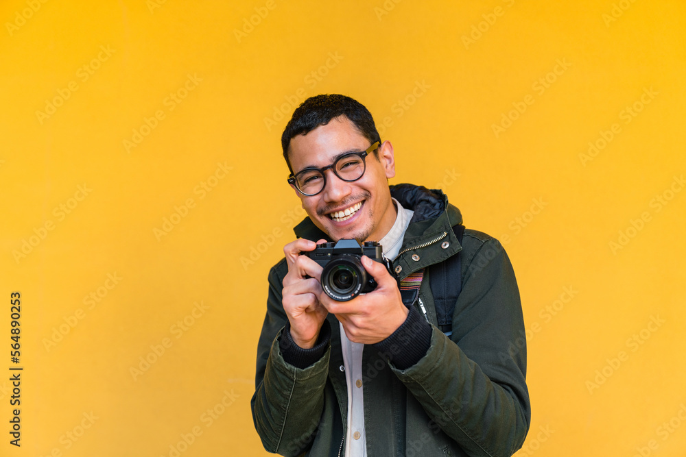 Candid Portrait of a Young Filipino Man with a Camera Candid Portrait of a Young Filipino Man with a Camera