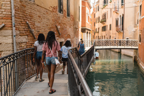 Tourists walking in venice photo