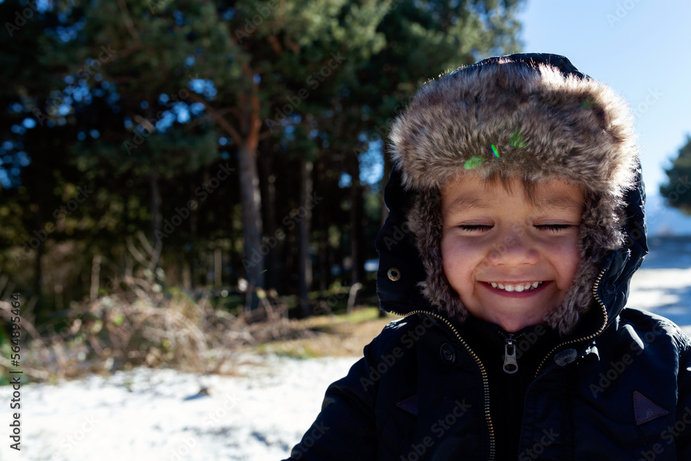 smiling little kid during winter time smiling little kid during winter time