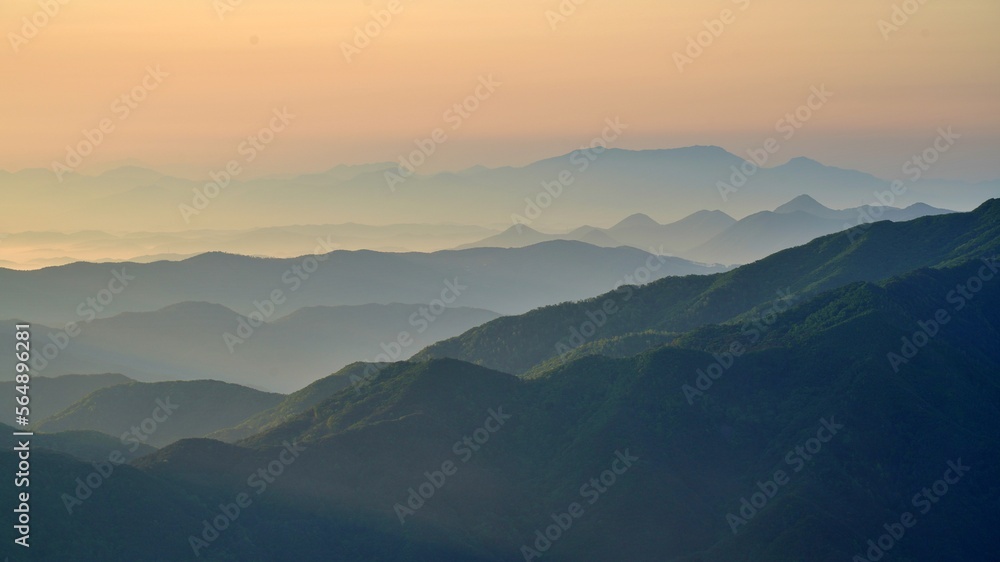 Fototapeta premium View of the surrounding mountains from the Hadong gliding field in South Korea