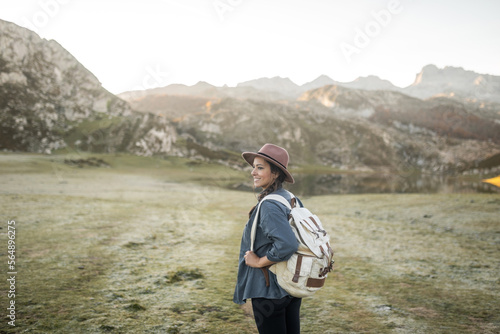 young woman with hat in nature photo