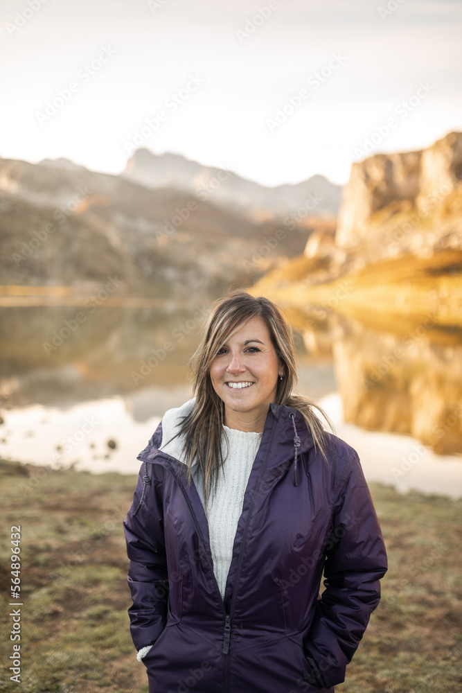 young woman in coat in nature young woman in coat in nature