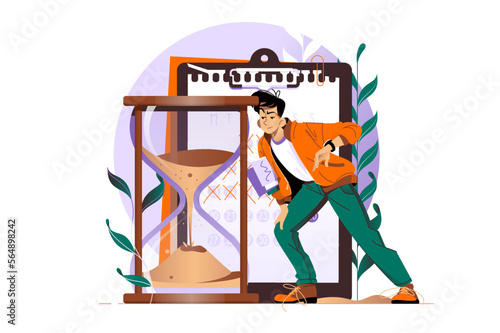 Timetracking, man looking at big hourglass photo