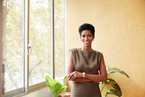 Smiling elegant black business lady in office photo